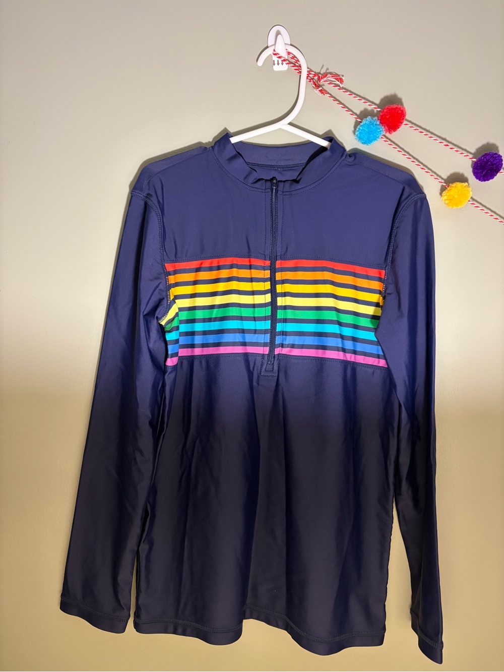 Primary rainbow stripe navy rash guard